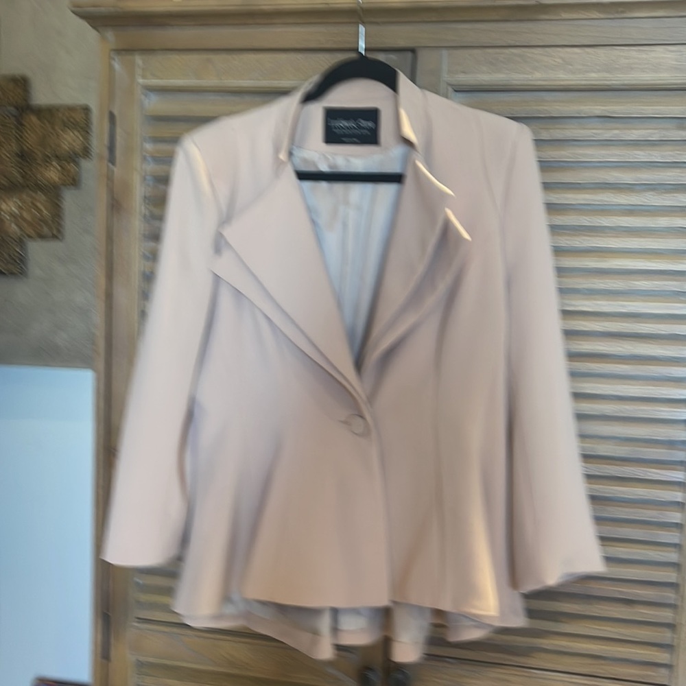 Peach, blush peplum jacket with shoulder pads. Fits like a 14